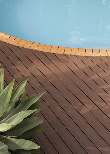 composite decking next to pool with agave plant