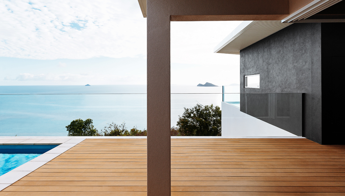 A composite decking with a view of the ocean.